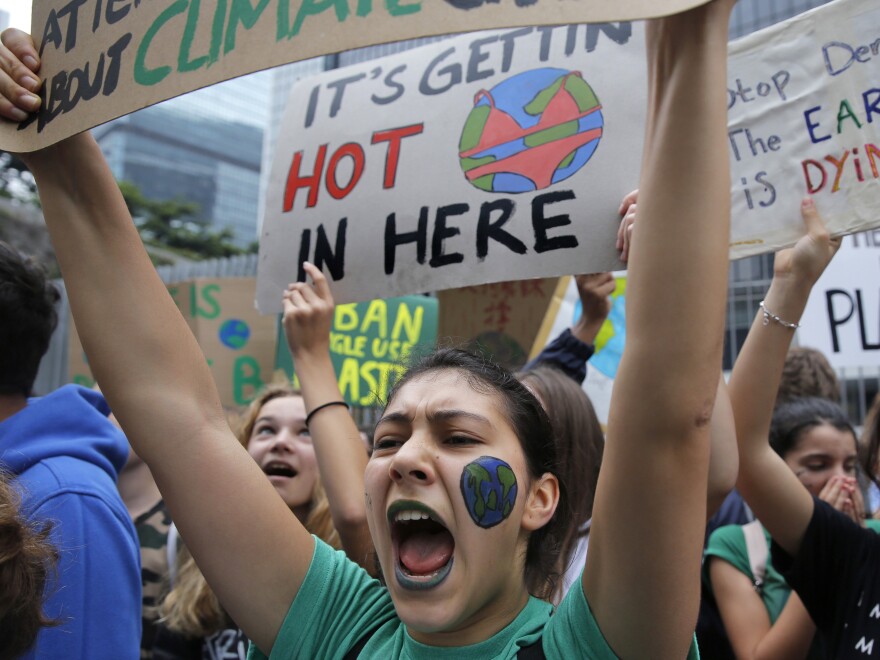 Hundreds of schoolchildren take part in a climate protest in Hong Kong Friday. So-called 'school strikes' were planned in more than 100 countries and territories, including the U.S., to protest governments' failure to act against global warming.