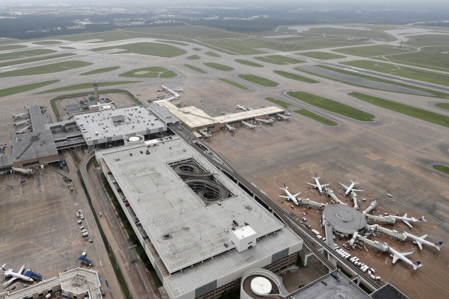 Planes are parked at George Bush Intercontinental Airport in Houston on Tuesday. The airport, which had been closed since Hurricane Harvey made landfall, opened with limited service on Wednesday.