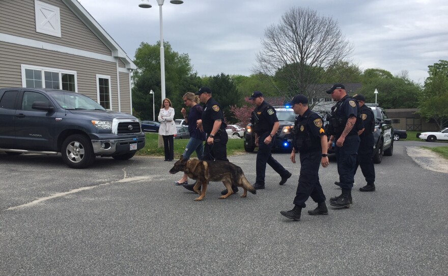 Ciro, a retired police dog, is led into the Pittsfield Veterinary Hospital for his last call.