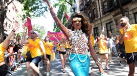 Lashauwn Beyond, of Fort Lauderdale, Florida, a finalist in RuPaul's Drag Race and the face of the Greater Fort Lauderdale Convention & Visitors Bureau LGBT campaign, marches in the New York Gay Pride Parade in 2014.