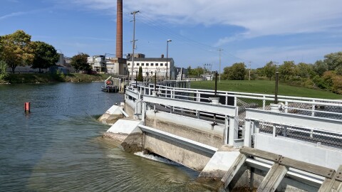 The Cheboygan dam and locks reopened Sept. 15 after a fire at the Tissue Depot [in the back] closed the facility for two days.