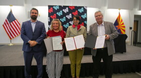Arizona Western College leadership hold up the memoranda of understanding agreements. From left to right: Dr. Shadi Kilani, executive vice president of AWC's Entrepreneurial College; Renee Macaluso, dean of mathematics, science and engineering at AWC; Dr. Reetika Dhawan, AWC president; and Bryan Doak, executive vice president of learning and student services.