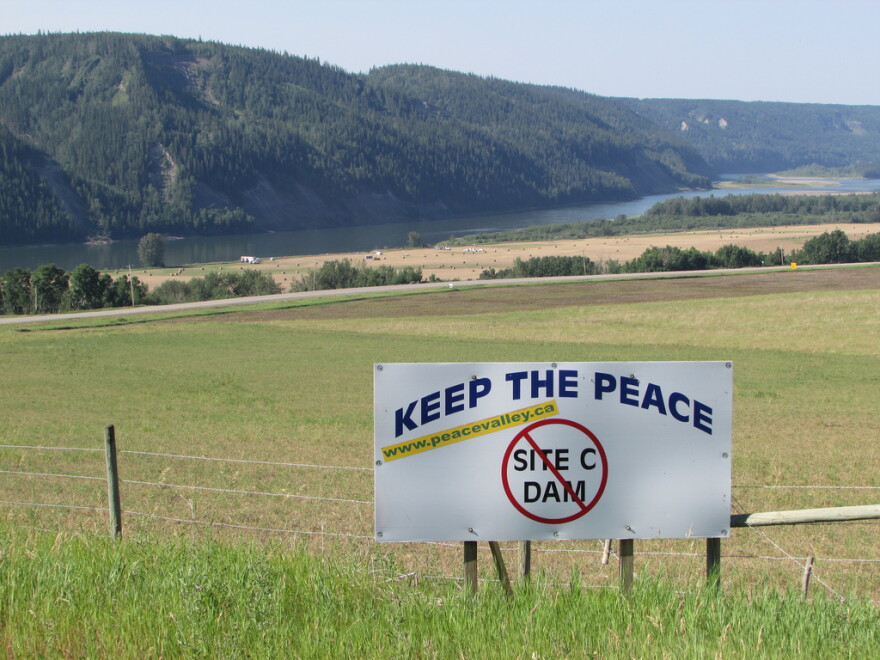 A sign along Highway 29 between Fort St. John and Hudson's Hope, British Columbia, protests the proposed Site C dam. 
