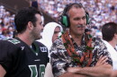 FILE - Hawaii coach June Jones and quarterback Nick Rolovich laugh during the fourth quarter action at Aloha Stadium in Honolulu on Dec. 8, 2001.