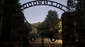 The Glenwood Cemetery gate is seen at dusk Aug. 18, 2025.
