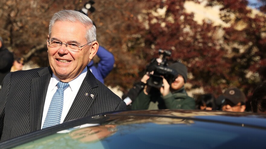 Sen. Robert Menendez, D-N.J., smiles as he leaves federal court in November.
