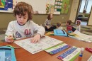 Students work in Joan Richie's kindergarten classroom at Bear Creek Community Charter School on Monday.