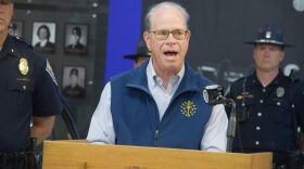 Gov. Mike Braun during a news briefing on Friday, May 22, 2026. He's wearing a navy blue vest with the Indiana flag emblem on it. 