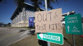 A sign notes the site is out of at-home COVID testing kits at Travis County Community Center at Oak Hill. 