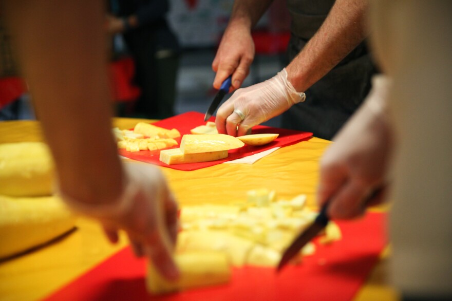 Chefs from José Andrés' ThinkFoodGroup chop squash that will go into a giant paella.