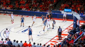 UD Arena was sold-out for the last game of the regular season on March 7, 2020, when the team won its 20th straight game. Here, Jalen Crutcher goes underneath the rim for a reverse layup during the Flyers victory.