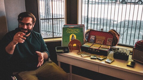 Omid J shows off some of his Afghan vinyl and cassette collection in Oakland.