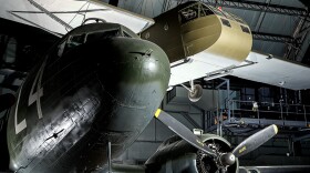 The WACO CG-4 glider on exhibit at the NMUSAF, above a C-47 which would have been a towing aircraft.