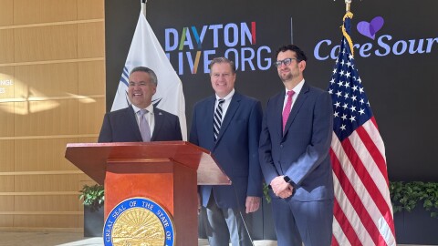Image of three men. Ohio Congressman Mike Turner (c) is flanked by Dayton Live CEO/President Gabriel van Aalst (r) and CareSource CEO/President Erhardt Preitauer (l). They are part of the planning team that will bring hundreds of international dignitaries to Dayton during the 2025 Memorial Day holiday. 