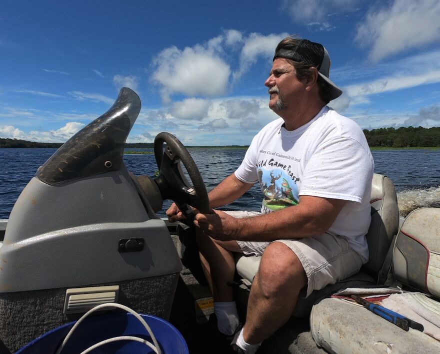 Steve Miller driving a boat