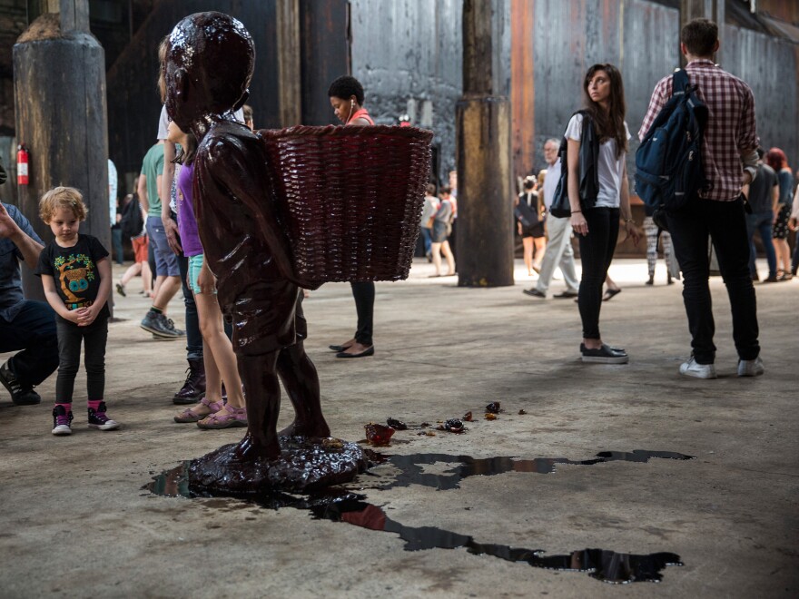 Walker's candy boy sculptures started melting fast in the non-climate-controlled factory, and the result looks a lot like blood.