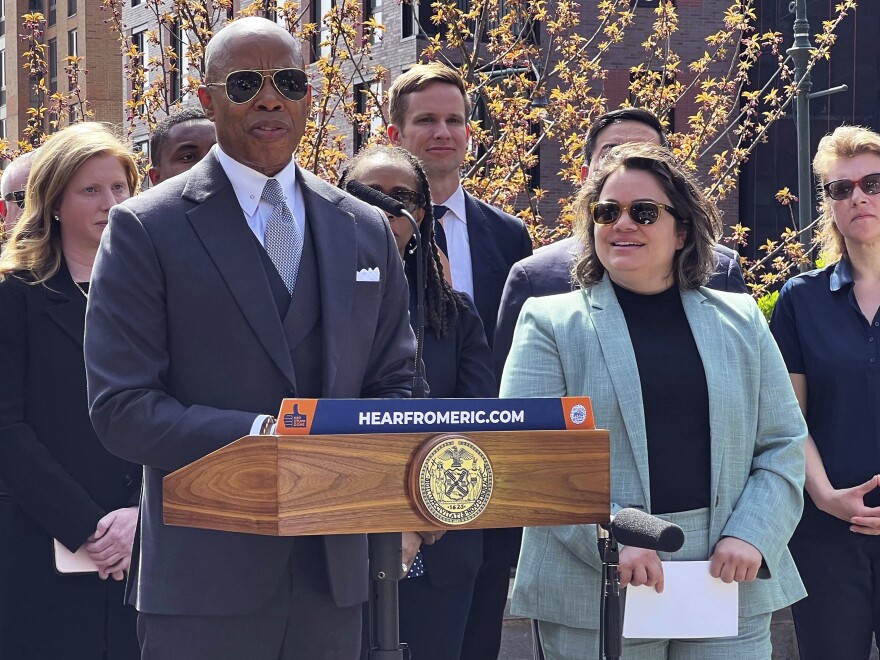 New York Mayor Eric Adams, left, introduces Kathleen Corradi, center, as the first-ever citywide director of rodent mitigation, also known as the "rat czar."