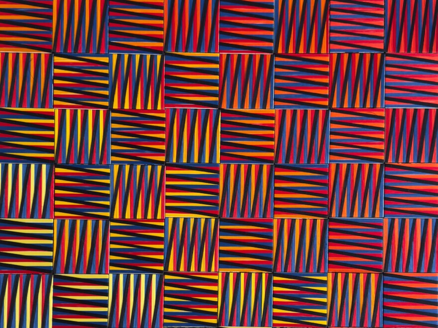 Damian Suarez's Cinetico. Suarez explores how structure can express emotion and how order can give way to wonder by using threads winding across wooden structures to transform into a language of light and rhythm.