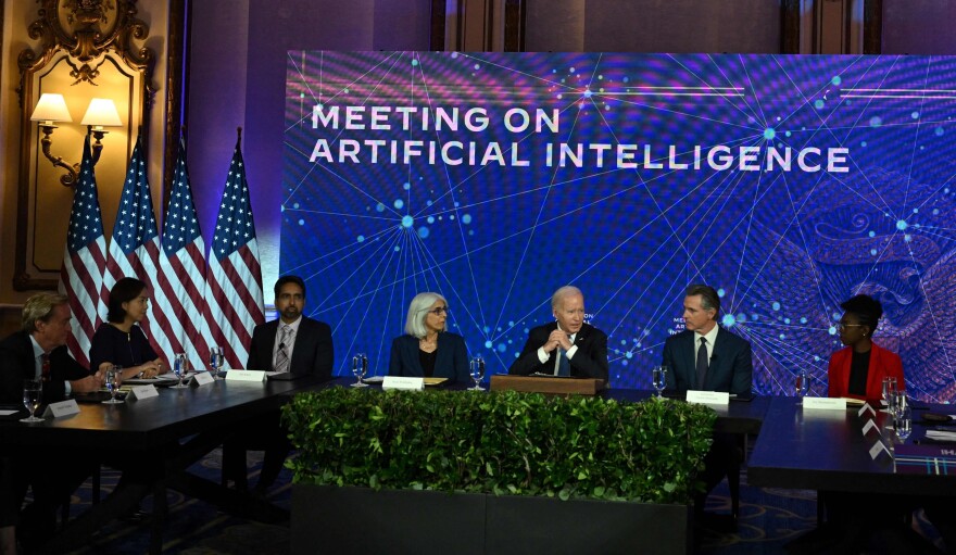 President Biden is pictured with leaders on artificial intelligence during a visit to San Francisco on June 20. On Friday, the White House announced voluntary agreements with technology companies on managing AI.