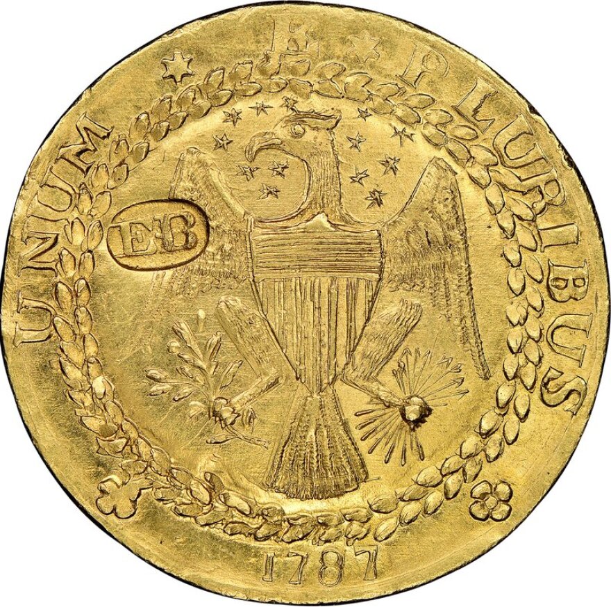 A rare gold coin featuring an eagle and the year 1787 on its face.