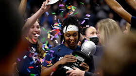 UConn guard Christyn Williams (center) wins the Most Outstanding Player after the Huskies defeated the Villanova Wildcats in the Big East Championship on March 7, 2022, at Mohegan Sun Arena in Uncasville, Connecticut.