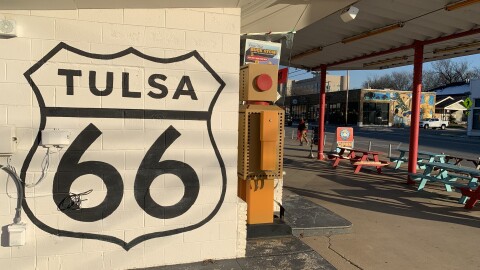 Route 66 signage is seen along the historic route on the side of Buck Atom's shop near 11th and Peoria