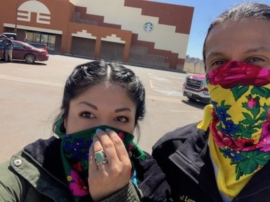 Adrian Lerma, and her husband Michael, stand outside the grocery store in Window Rock, Ariz. They're buying food for elders in their community.