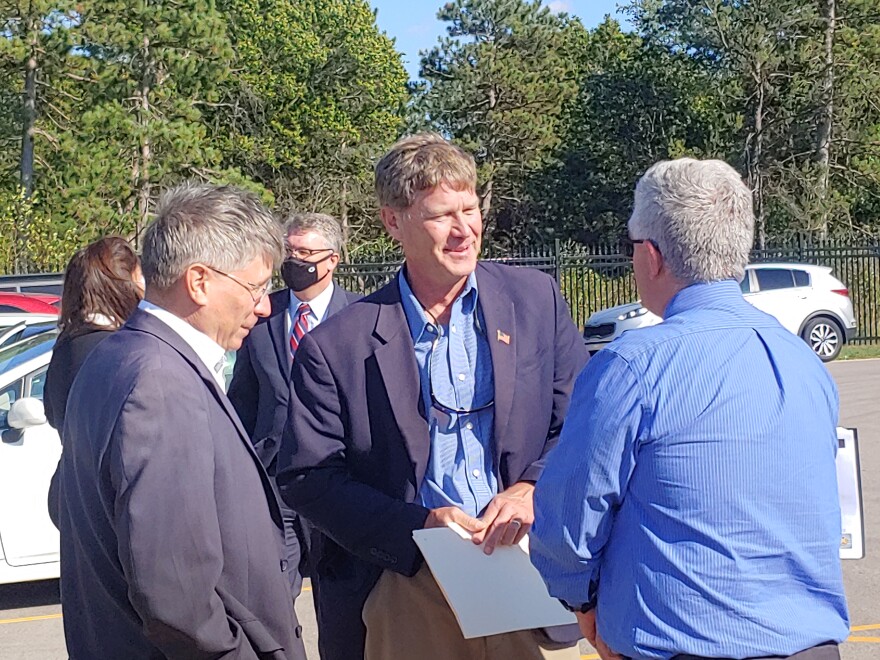 U.S. Rep. Ron Kind (D-LaCrosse) (center) listens to other officials after Tuesday's news conference.