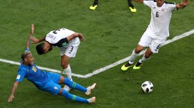 In a June 22 World Cup Match in St. Petersburg, Russia, Costa Rica's Giancarlo Gonzalez fouls Brazil's Neymar (in blue at left), but the penalty was rescinded after Video Assistant Referee review. Brazil went on to win 2-0.