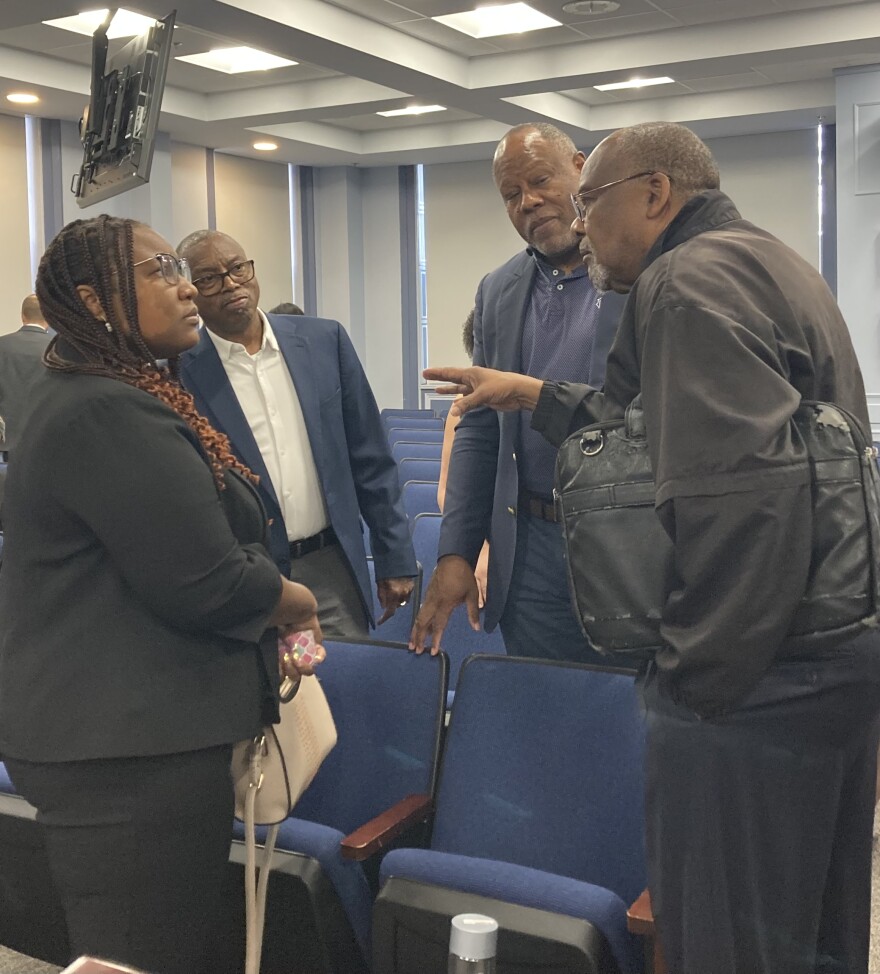 Corlisha Mitchell speaking with Frederick County residents and businessmen after the disparity study announcement.