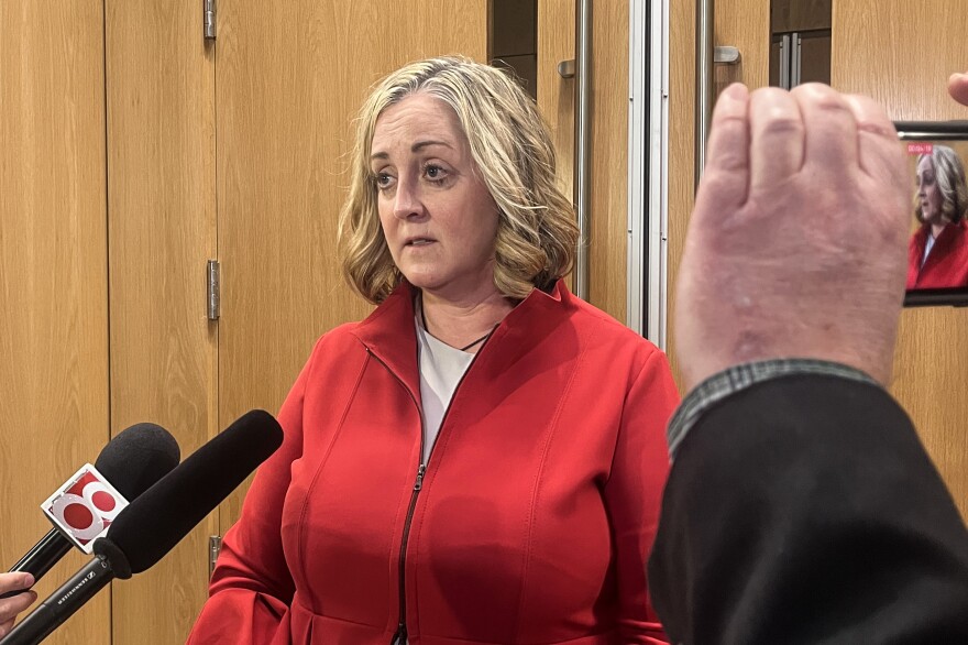 Bernard's attorney, Kathleen DeLaney, speaks to reporters outside of the courthouse.