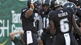 South Florida quarterback Byrum Brown (17) celebrates his touchdown against Boise State with wide receiver Keshaun Singleton (11) and wide receiver Mudia Reuben (6) during the first half of the Bulls' win over the 25th-ranked Broncos at Raymond James Stadium Thursday, Aug. 28, 2025.