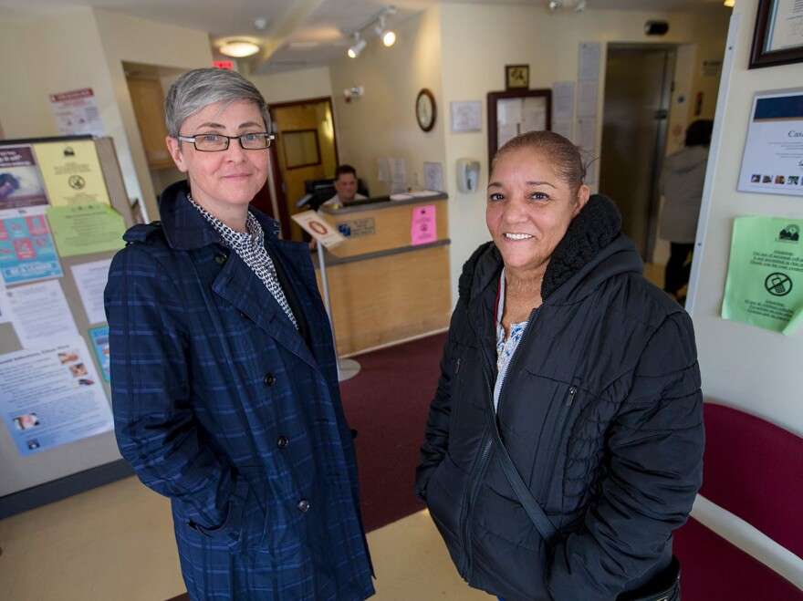 Executive Director Emily Stewart, left, and Director of Programs Anna Rodriguez standing in the lobby of the Casa Esperanza Familias Unidas Outpatient Services.