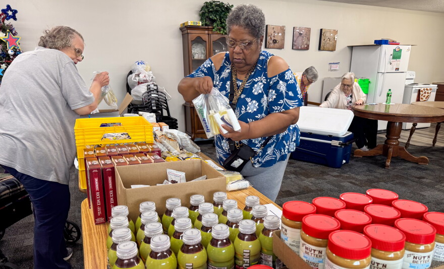 Linda Rufus selects food from the Food Bank of Iowa at an apartment complex in Storm Lake, Iowa, on Thursday, July 16, 2026. Rufus said the pop-up pantry at Storm Lake Senior Living helps her make ends meet.