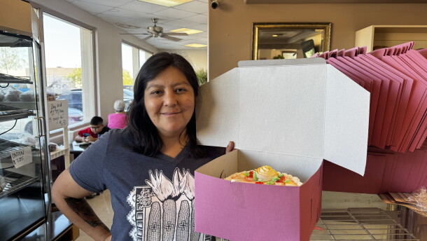 Theresa Jackson, a Yuma native, picks up a birthday cake for her granddaughter's first birthday.
