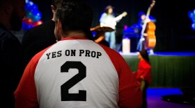 A Proposition 2 supporter waits for results on election night at a watch party for patient advocates in Utah.