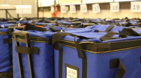 Blue fabric bozes on rollers