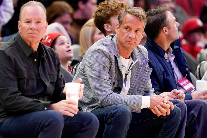 LSU football head coach Lane Kiffin, right, watches an NBA basketball game between the Houston Rockets and the Dallas Mavericks, Saturday, Jan. 31, 2026, in Houston. (AP Photo/Eric Christian Smith)