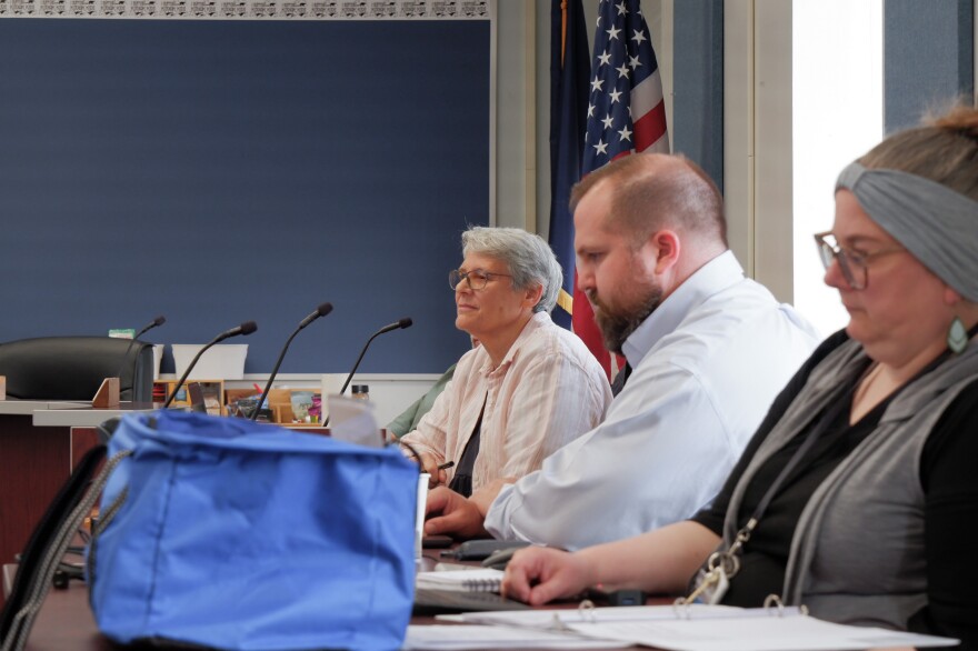 Board President Kerry Irons, Assistant Superintendent Damon Hargraves, and Board secretary Laurie Pardoe listen to a member of the public during the regular meeting on July 13