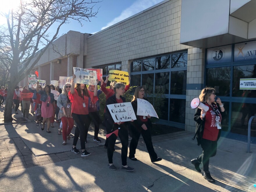 Before the school day, teachers at Westlane Middle School rallied outside of the school to call on lawmakers to increase school funding.