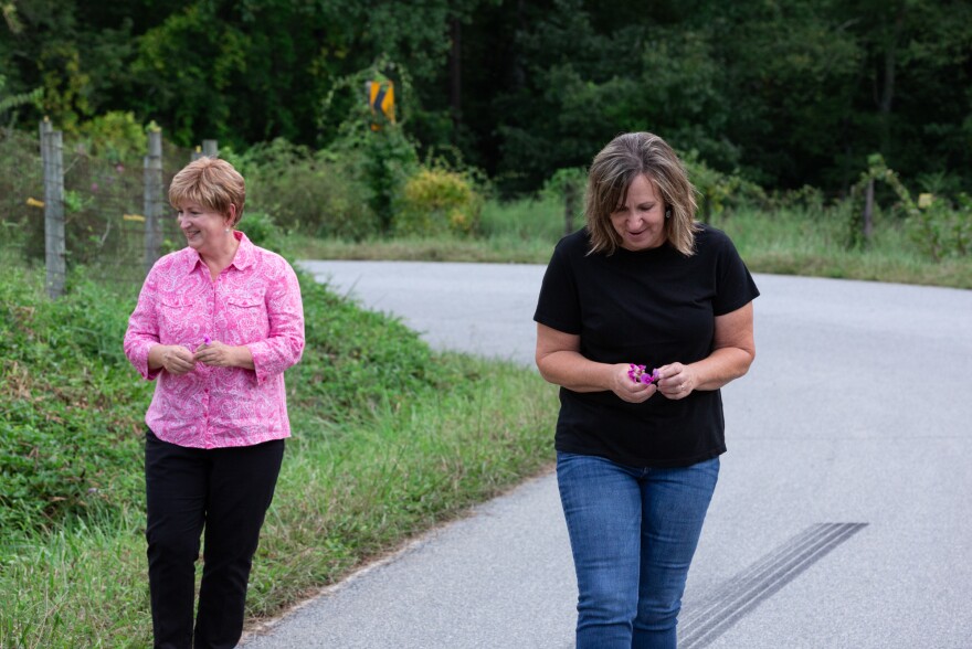 Ward (left) and Douthitt pick wildflowers down the road from their childhood home in Swannanoa, N.C.