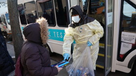 Binax Covid-19 testing kits are handed out in the Bensonhurst section of the Brooklyn borough of New York City on December 23, 2021