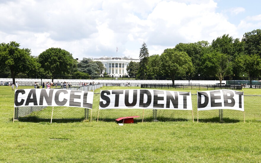 In June, borrower advocates erected signs in front of the White House calling on President Joe Biden to cancel student debt.