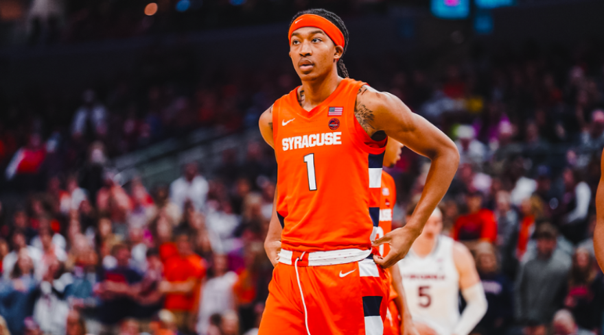 Maliq Brown (Orange) prepares for action against Virginia.