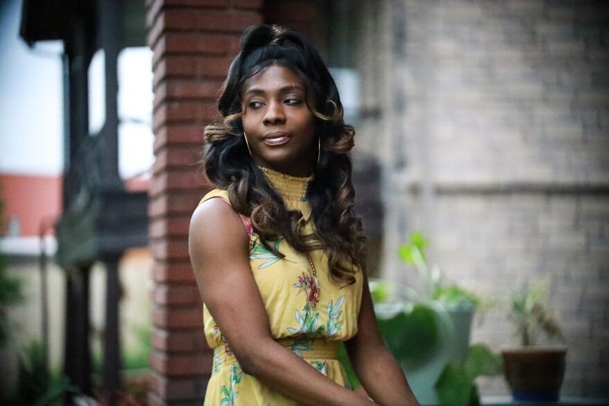  Nyla Foster sits on her front porch in Kansas City, Missouri. She says she's always planned to leave town, but this legislation has given her the extra push she needed. Come August when her lease ends, she's out. 