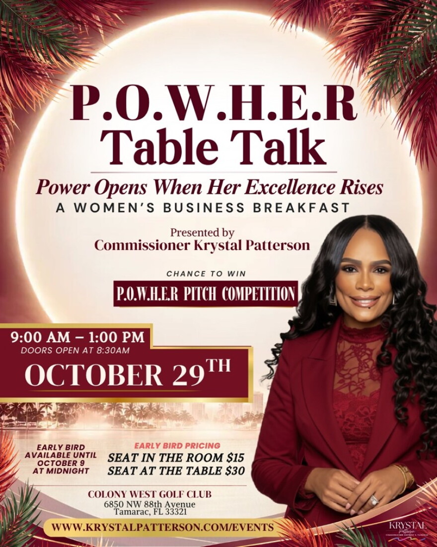 Woman in red suit in front of flyer for a event on October 29th.