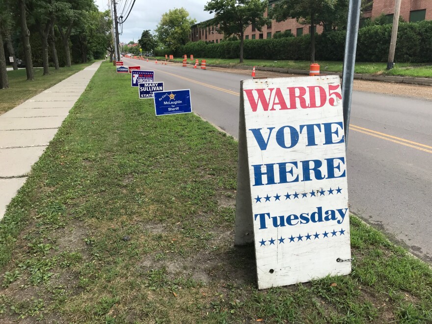 A sign lets Burlington's Ward 5 voters know where to vote Tuesday, as various candidate signs line up behind it.