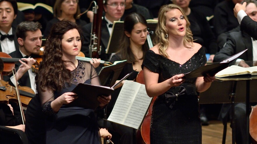 Opera singer with orchestra behind