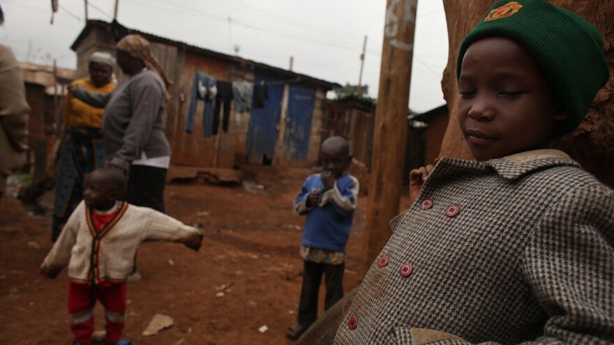The children of Millicent Atieno play in front of their home in August 2009 in the Kibera slum in Nairobi, Kenya. Millicent was one of dozens of Kibera residents to start a local business with the assistance of cash grants provided by a nongovernmental organization. Hairdressers, grocery stores and food vendors were just some of the businesses financed through the program.