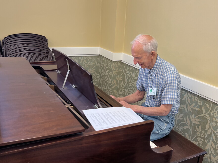 David Wilkin sits down at the piano after the memory cafe's activities ended.